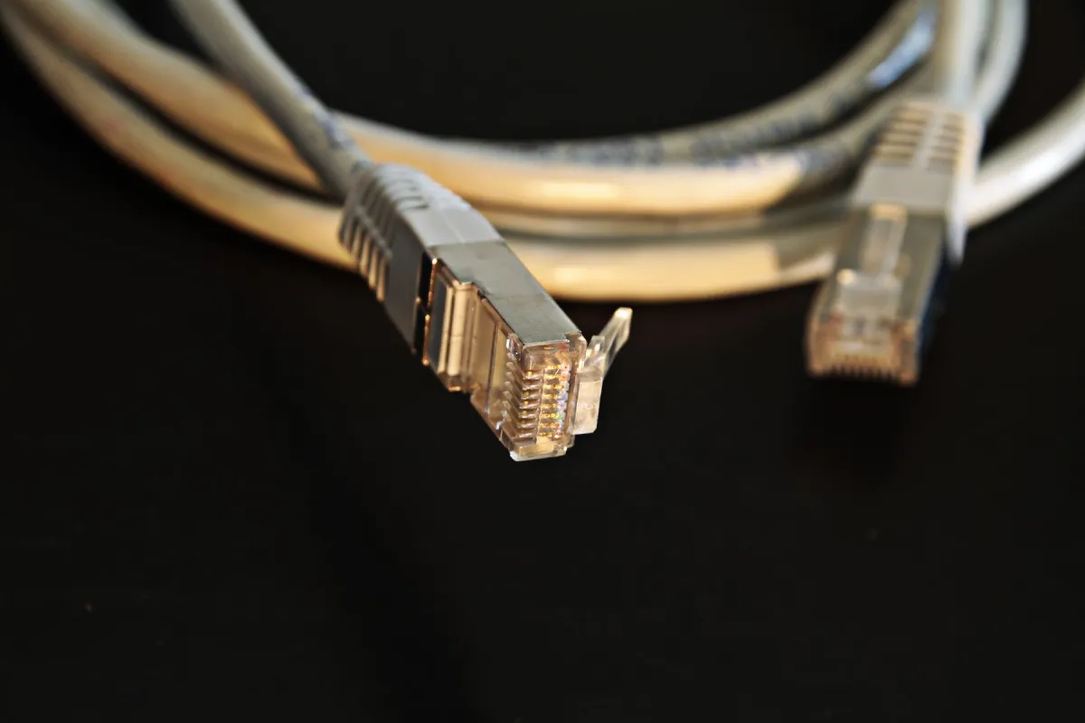 Ethernet cable connectors photographed against a dark background